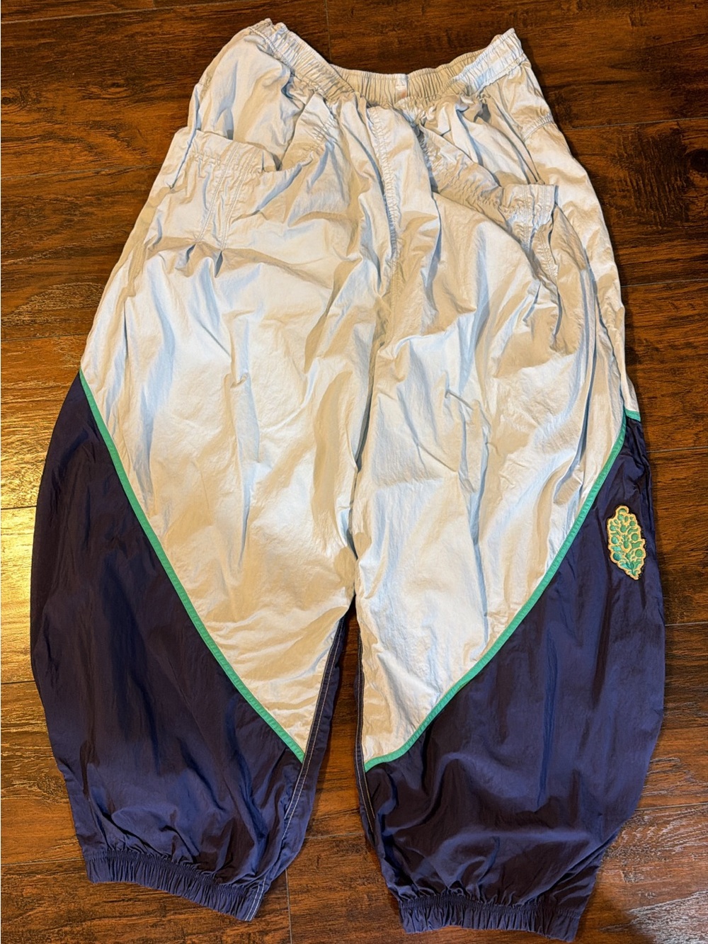 FP women’s Windbreaker Track Pants in Light Gray and Navy
